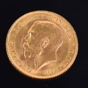 1912 English gold sovereign coin. 22mm diameter. Scattered minor dings to edges. 8 grams.