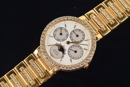 Piaget 18K gold and diamond dress automatic perpetual calendar wristwatch. Bezel set with circle of