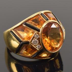 18K gold heavy topaz and diamond mounted ring. Large cut central stone flanked by 3 round cut