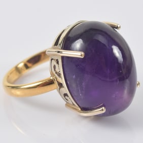 Tiffany & Co. 18K gold large amethyst ring. Polished domed cabochon measuring about 21 x 15.8mm.
