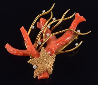 14K gold sea form coral and diamond brooch. Natural form coral specimen entwined in a gold setting