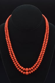 Vintage 14K gold dual strand coral beaded necklace. Graduated beads, largest approx. 9mm diameter.