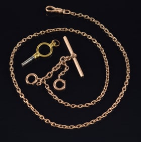 Antique 14K and 10K gold pocket watch chain with slide attachment. Chain tests as 10K, clasp marked