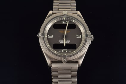 Breitling Swiss chronograph 1884 aerospace wristwatch. Titanium case. Quartz movement. Together with