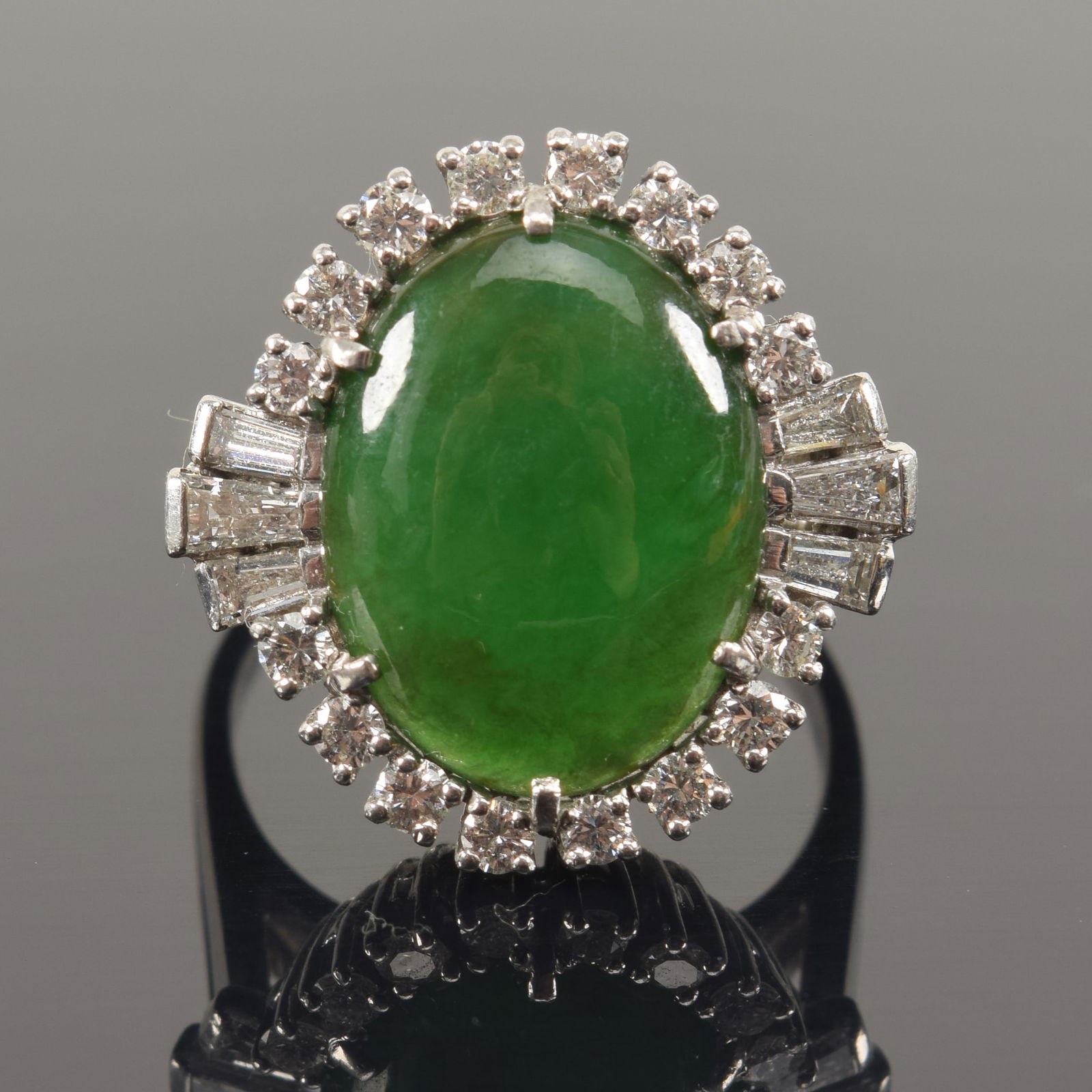 Retro jade and diamond platinum ring. Central jade stone of a deep green color. Measures approx. (1 of 9)