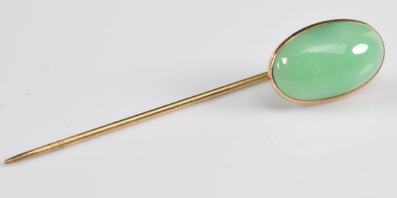 14K gold apple green jade mounted stick pin. Jade cabochon measures about 17 x 10mm. Pin marked on
