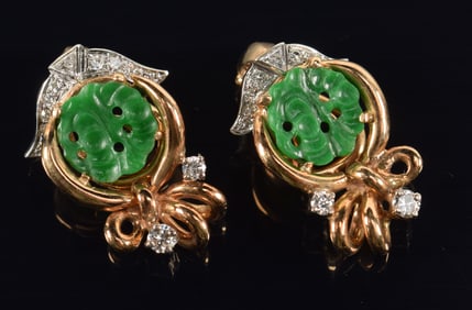 14K gold jade and diamond mounted earrings. Pierced green jade discs in gold bow setting with white