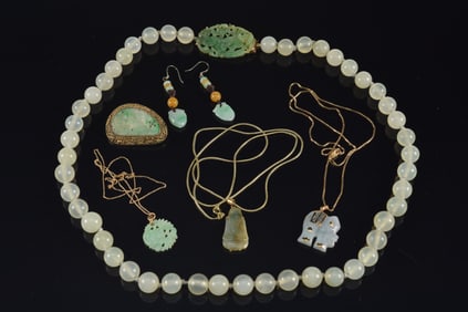 Lot of jade jewelry. 1) 14K gold nephrite bead necklace with carved jade clasp. 2) Gilt silver