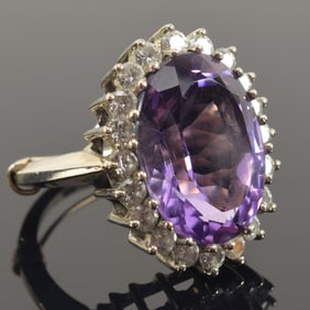 14K gold amethyst and diamond ring. Large oval cut amethyst measuring 12.7 x 16.3mm. Surrounded by