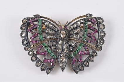 Georgian silver and gold diamond, ruby, and emerald mounted butterfly form brooch. Stones of various