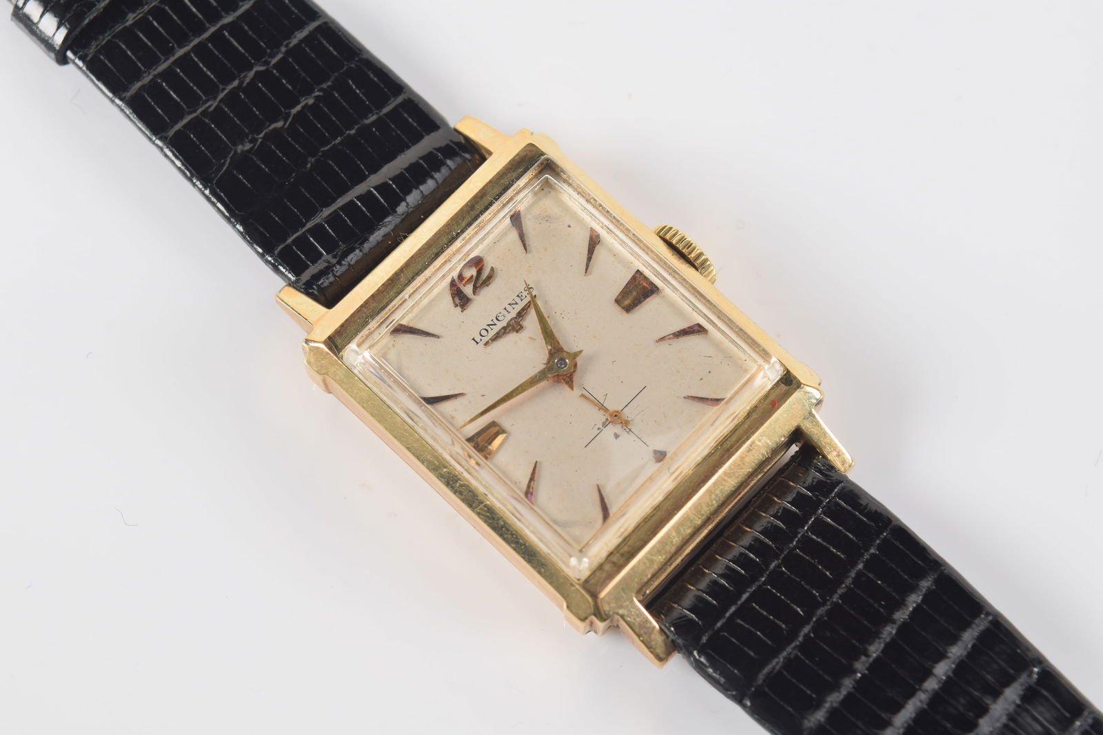 Longines 14K gold wristwatch. Leather band. Case marked 14K and maker's mark. Band length 8.25in.: Longines 14K gold wristwatch. Leather band. Case marked 14K and maker's mark. Band length 8.25in.