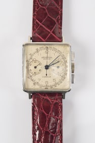 Universal Compur chronograph wristwatch, ca 1950. Swiss made. Stainless steel case with two serial