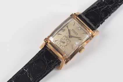 Gruen Curvex 14K gold and diamond vintage wristwatch. Dial set with diamonds at 12, 3, and 9