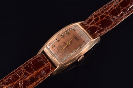 Gruen Curvex 14K gold vintage wristwatch. Gold Arabic numerals on dial. Case marked 14K and maker's