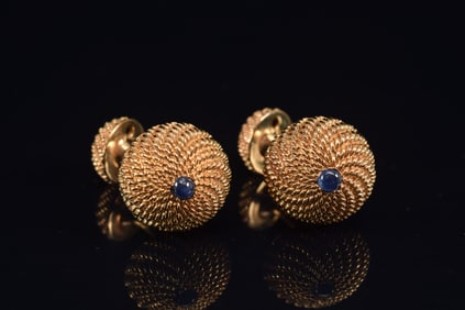 14K gold heavy sapphire mounted cuff links. Braided gold design. Marked. 1 1/8in long. 17.2 grams.