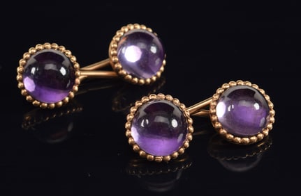 14K gold amethyst cufflinks. Round cabochon amethyst stones. Unmarked, tests as 14K. 1.25in wide.