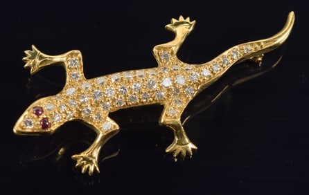 18K gold diamond and ruby mounted lizard pin. Marked 18K on foot. 2in length. 6.1 grams.