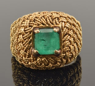 18K gold emerald ring. Woven design setting. Square cut emerald measures 5.7mm x 5.7mm. Unmarked but