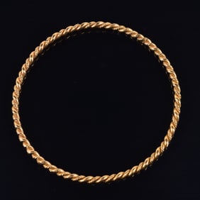 14K gold twisted bangle bracelet. 2.75in diameter. Unmarked, tests at least as 14K. 13.3 grams.