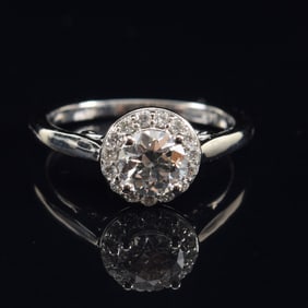 14K white gold diamond solitaire ring. Round brilliant cut diamond measures 0.67 ct. Color: H.