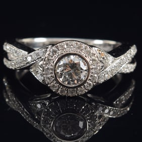14K white gold diamond solitaire ring. Round brilliant cut center stone approx. 0.45 ct. F-G color.