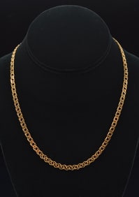14K gold fancy chain link necklace. Marked 14K Italy. 17in length. 8.9 grams.