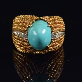 18K gold turquoise and diamond mounted ring. Unusual elongated braided gilt setting. Marked 750.