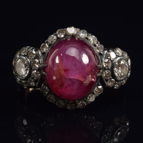 Antique gold and silver star ruby and diamond mounted ring. Ruby measuring approx. 9 x 11 x 5mm.