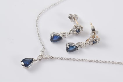 14K white gold sapphire and diamond jewelry suite. 1) Necklace with pear shaped sapphire and 3 cut