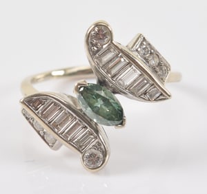 Vintage 14K white gold diamond bypass ring. Marquise cut irradiated green diamond measures 6.9 x