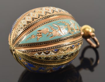 14K gold enamel decorated egg form locket, possibly Russian. Various engraved and enameled panels of