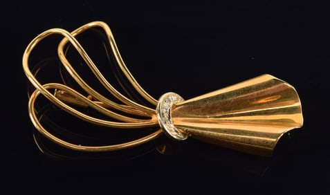 18K gold modernist style pin. Band of several tiny round cut diamonds. Post marked 750. 2in length.