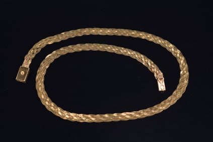 14K gold braided necklace. 16in length. Marked 14K. 9 grams.