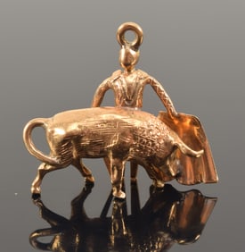 18K gold bullfighting charm/pendant. 1in wide. Unmarked, tests as 18K. 6.9 grams.