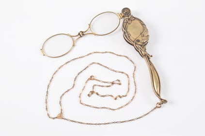 Art Nouveau sterling silver lorgnette. Gold filled chain. Spring slightly loose. Marked on interior.