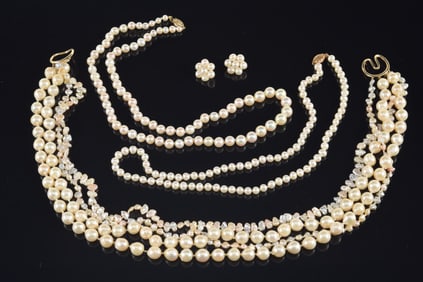 Lot of 14K gold pearl jewelry. To include: 1) Quadruple strand necklace with 14K gold clasp. Marked.