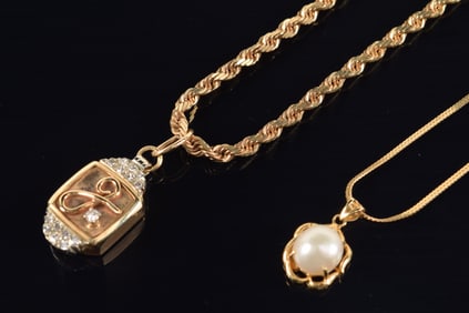 [2] gold items. 1) 14K gold pearl pendant on gold filled necklace. 2) 14K gold diamond set locket