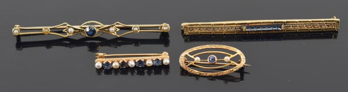 4 vintage gold sapphire mounted bar pins. 2 marked 14K (1 large, 1 small), 2 marked 10K (1 large, 1
