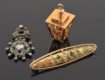 Lot of gold jewelry. To include: 1) English 14K gold diamond and emerald mounted pin. Partial marks