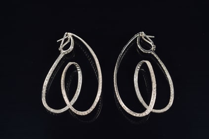 18K white gold diamond double helix inside-out hoop earrings. Unmarked, test as 18K. 2.25in length.