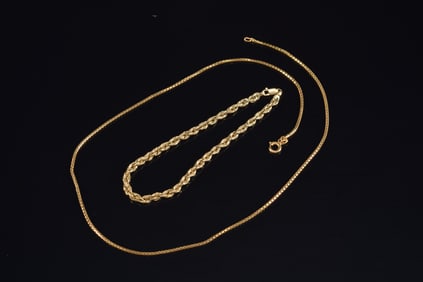 [2] 14K gold items. 1) Tennis bracelet. Marked 14K and "Ma". 7.5in length. 2.5 grams. 2) Block chain