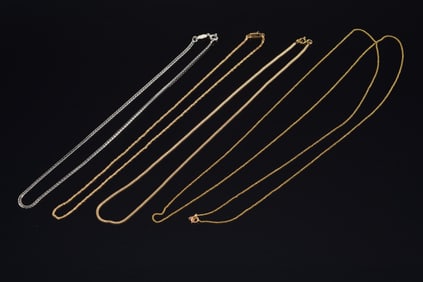 Lot of [4] 14K gold chains. Lengths: 36in, 14in (white gold), 16in, and 16in. 16.3 grams.