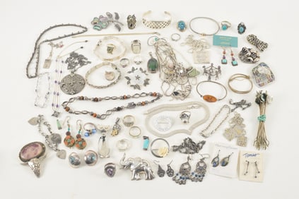 Large lot of assorted silver and sterling silver jewelry. To include: turquoise rings, bracelets,