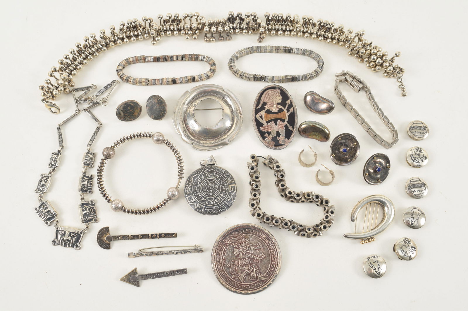 Large selection of silver jewelry, including Mexican and South American motifs, heavy "X" form (1 of 9)