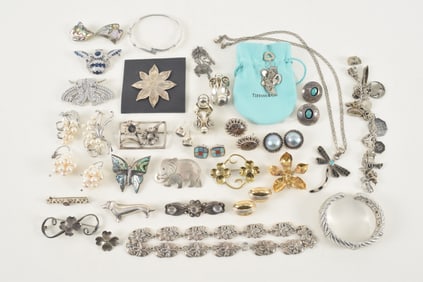 Large lot of silver jewelry. To include: antique style blue stone mounted insect pin, art deco style