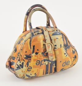 Christian Dior graffiti leather saddle bowler bag. Label on interior. Light wear on base from use.