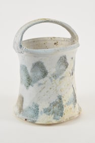 Betty Woodman. American. Glazed earthenware art pottery handled vessel. Spiral faceted body with