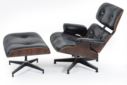 Charles and Ray Eames lounge chair and ottoman, late 20th Century. Rosewood laminate with black