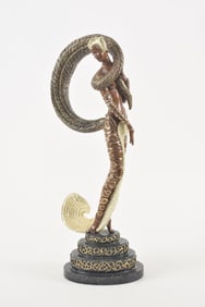 Erte "Masquerade" patinated bronze sculpture. Partial nude figure dressed in art deco costume.