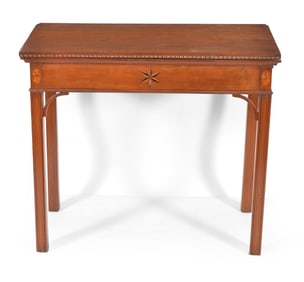 Connecticut cherry games table with chip carved rectangular top above an apron with corner brackets,